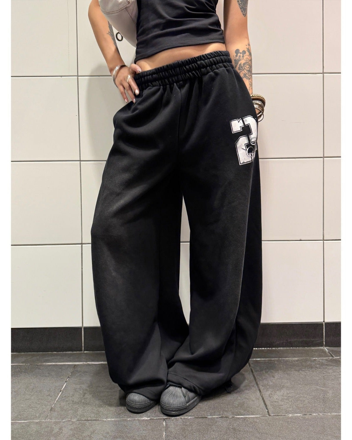 Black number print trousers